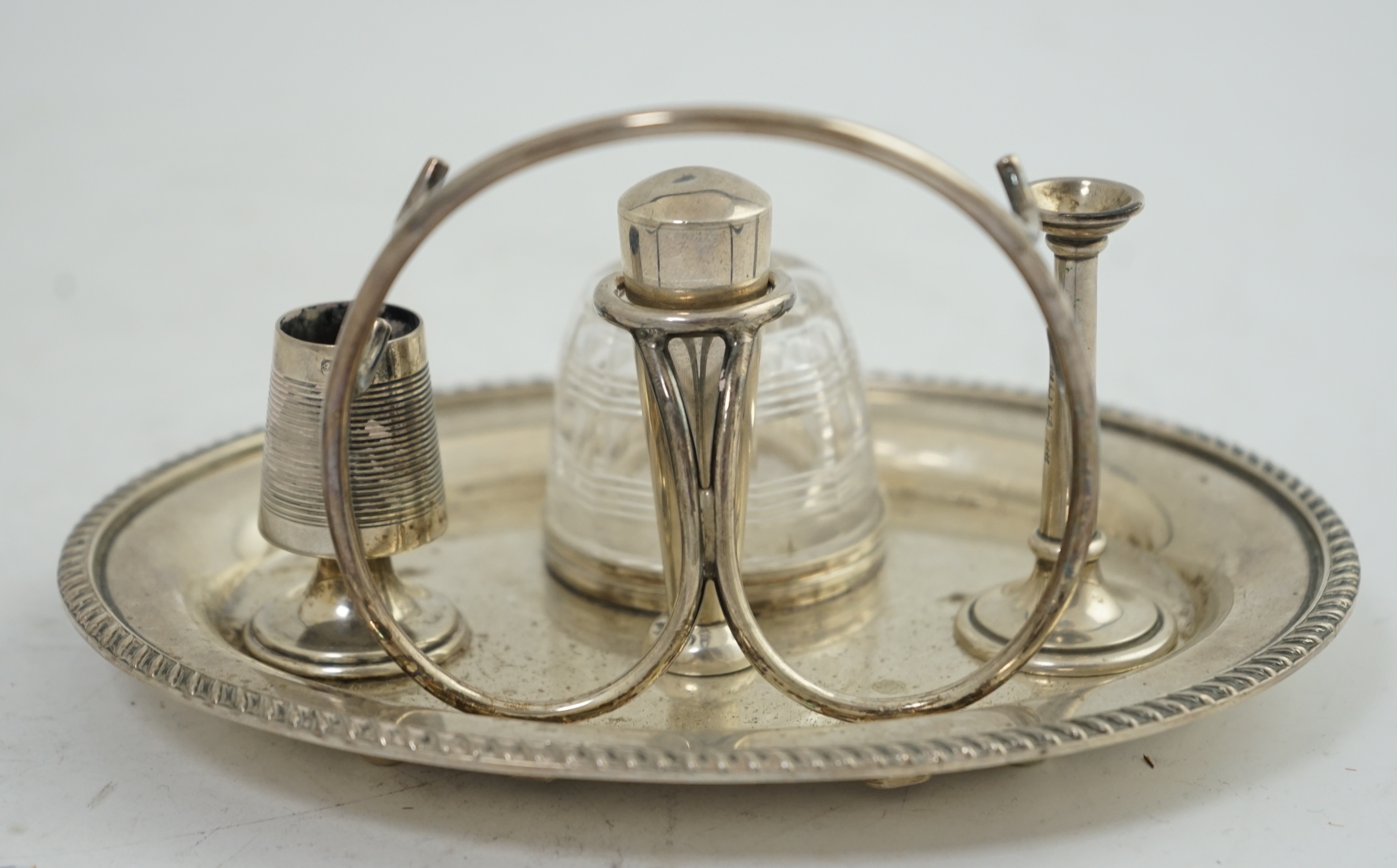 A late Victorian oval silver inkstand, with later RAF presentation inscription, maker Hukin & Heath